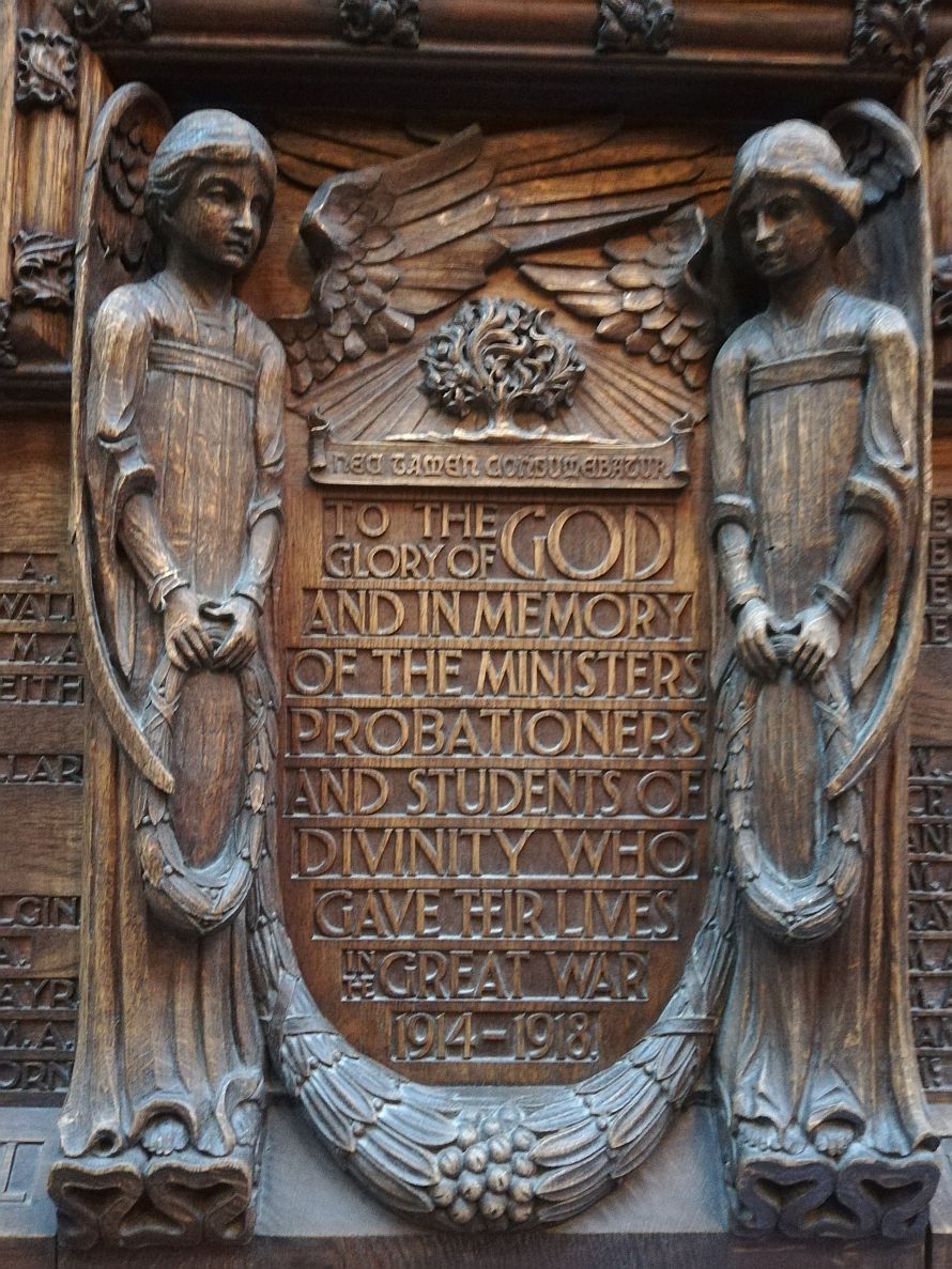 Centre panel of the carved wooden plaque war memorial at New College